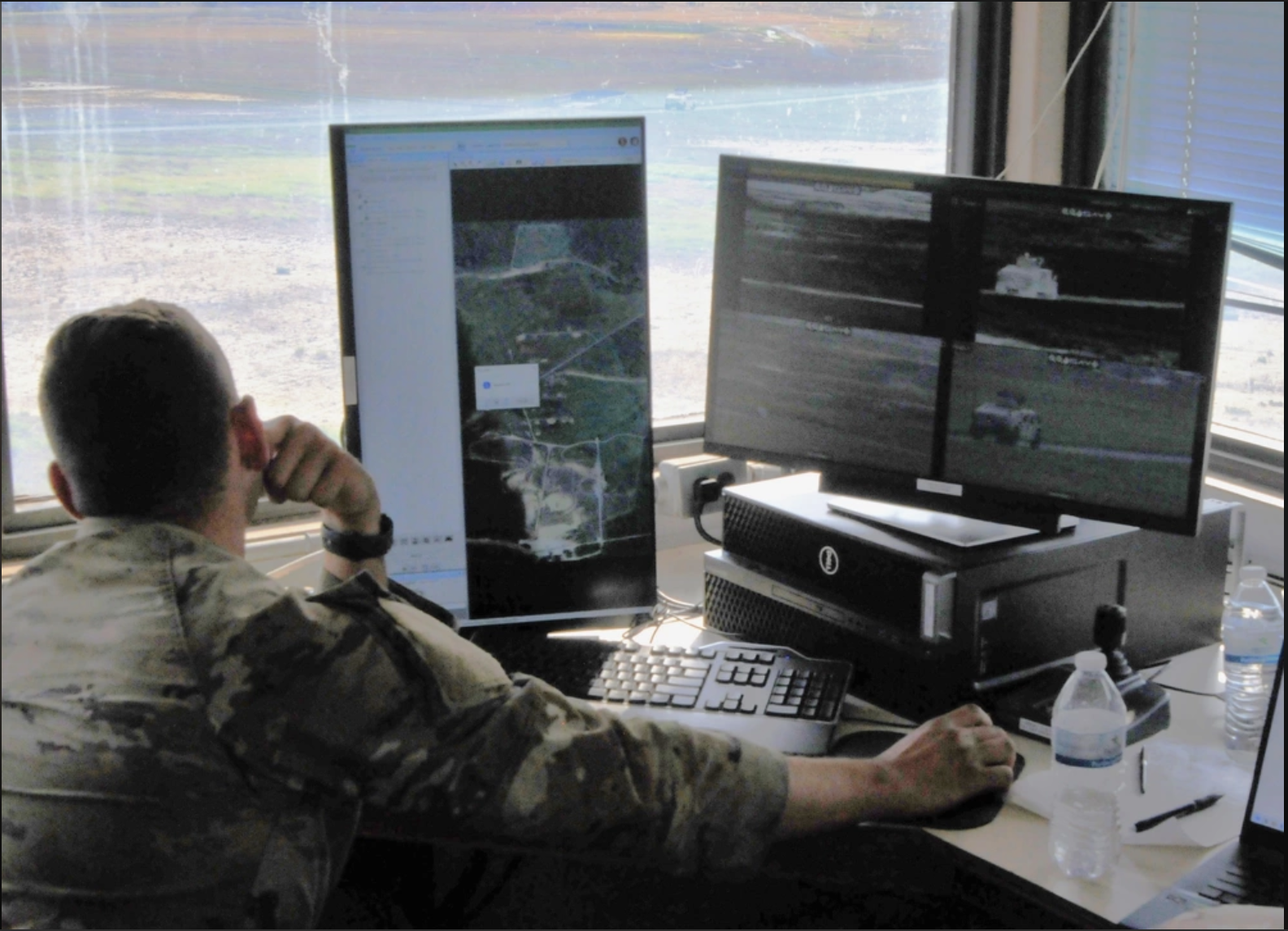 Range control operator monitoring tower targets